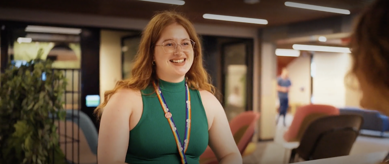 Woman in green tshirt smiling